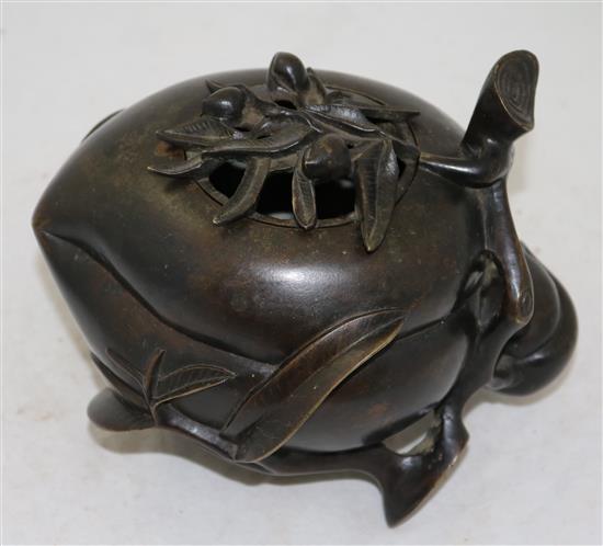 A large Chinese bronze peach-shaped censer and cover, 17th/18th century, height 17.5cm, length 21cm